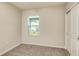 This bedroom features a closet, neutral carpet, light walls, and a window offering natural light at 5433 Sw 82Nd Ter, Ocala, FL 34481
