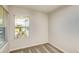 Bright bedroom featuring neutral carpet, light walls, and a window offering natural light and views at 5433 Sw 82Nd Ter, Ocala, FL 34481