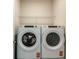 A well-lit laundry room featuring a new Whirlpool washer and dryer at 5433 Sw 82Nd Ter, Ocala, FL 34481