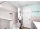 Bathroom with subway tiled shower, neutral color scheme and modern vanity at 7013 Beverly Rd, Lakeland, FL 33813