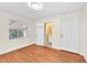 Bedroom features hardwood floors, natural light, and an en-suite bathroom at 7013 Beverly Rd, Lakeland, FL 33813
