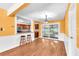 Open dining room with view to the kitchen and outdoor patio at 7013 Beverly Rd, Lakeland, FL 33813