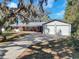 Ranch home with large driveway and separate two car garage at 7013 Beverly Rd, Lakeland, FL 33813