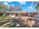 Cozy single-story brick home with covered front porch at 7013 Beverly Rd, Lakeland, FL 33813