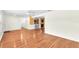 Open concept living room features hardwood floors with kitchen view at 7013 Beverly Rd, Lakeland, FL 33813