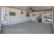 Covered back patio featuring a concrete floor, exterior access door, and windows at 7013 Beverly Rd, Lakeland, FL 33813
