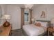Cozy bedroom with plush bed, soft lighting, and charming decor details. Ready to relax at 8207 Sw 52Nd Lane Rd, Ocala, FL 34481