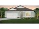 Charming single-Gathering home featuring a two-car garage, well-manicured lawn, and beautiful landscaping at 8207 Sw 52Nd Lane Rd, Ocala, FL 34481