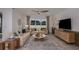 Inviting living room featuring a large window, comfortable seating, stylish decor, and ceiling fan at 8207 Sw 52Nd Lane Rd, Ocala, FL 34481