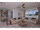 Open-concept living room and dining area with stylish furnishings, neutral color palette, and ample natural light at 8207 Sw 52Nd Lane Rd, Ocala, FL 34481