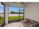 Relax on this covered patio with comfortable seating, views of a well-maintained backyard at 8207 Sw 52Nd Lane Rd, Ocala, FL 34481