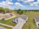 Charming single-Gathering home features a well-manicured lawn, attached two-car garage, and welcoming front porch at 1780 Jackson Oaks Dr, Bartow, FL 33830