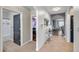 Hallway with tile floors, an archway to the living space, and access to the bathroom and bedrooms at 1780 Jackson Oaks Dr, Bartow, FL 33830