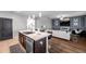 Open-concept kitchen with island overlooking the living room at 1780 Jackson Oaks Dr, Bartow, FL 33830