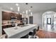 Well-lit kitchen with a large island, stainless steel appliances, and stylish pendant lights at 1780 Jackson Oaks Dr, Bartow, FL 33830
