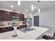 Modern kitchen with stainless steel appliances, breakfast bar, and dark cabinetry at 1780 Jackson Oaks Dr, Bartow, FL 33830