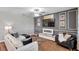 Modern living room featuring a white couch, sleek furniture, and stylish decor at 1780 Jackson Oaks Dr, Bartow, FL 33830
