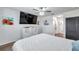 Spacious main bedroom with modern furniture, a large TV, and stylish decor at 1780 Jackson Oaks Dr, Bartow, FL 33830