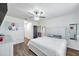 Bright main bedroom with a ceiling fan, stylish decor, and a comfortable bed at 1780 Jackson Oaks Dr, Bartow, FL 33830