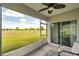 View of the screened-in porch and backyard at 1780 Jackson Oaks Dr, Bartow, FL 33830
