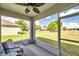 Relaxing screened porch with comfortable seating and a view of the expansive backyard at 1780 Jackson Oaks Dr, Bartow, FL 33830