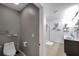 Neutral-toned powder room with toilet and access to the bright, modern bathroom at 1780 Jackson Oaks Dr, Bartow, FL 33830