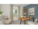 Bright home office with a sleek desk, comfortable chair, and shelving for storage at 2418 Slippery Rock St, Auburndale, FL 33823