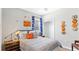 Charming bedroom with sports-themed décor, creating a fun and inviting atmosphere at 5107 Bridgehaven Rd, Davenport, FL 33837