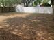 Large, open backyard featuring a tall white fence providing privacy and ample space at 645 W Winter Park St, Orlando, FL 32804
