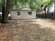 Spacious backyard offers a private outdoor space with mature trees and natural surroundings at 645 W Winter Park St, Orlando, FL 32804