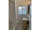 Well-lit bathroom with classic black and white tile flooring, a window, and a modern vanity at 645 W Winter Park St, Orlando, FL 32804