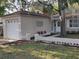 Charming home with a white garage door, decorative brickwork, and landscaped front yard at 645 W Winter Park St, Orlando, FL 32804