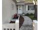 Charming front entrance features a white door, decorative plants, and a curved walkway at 645 W Winter Park St, Orlando, FL 32804