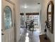 Inviting hallway featuring tile floors leading to breakfast nook with a round table at 645 W Winter Park St, Orlando, FL 32804