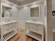 Bright bathroom featuring double vanities, ample lighting, and modern fixtures at 23 Buck Cir, Haines City, FL 33844