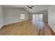 Spacious living room with vaulted ceilings, ceiling fan, and sliding doors to the outside at 23 Buck Cir, Haines City, FL 33844