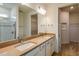 Modern bathroom with dual sinks, quartz countertops, and walk-in shower at 5831 Sw 87Th Ave, Ocala, FL 34481