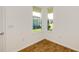 Bright bedroom featuring wood flooring and an abundance of natural light from dual windows at 5831 Sw 87Th Ave, Ocala, FL 34481