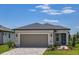 Charming single-story home with a two-car garage and well-manicured landscaping at 5831 Sw 87Th Ave, Ocala, FL 34481