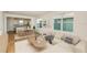 Bright living room with modern decor, open to kitchen, and featuring lots of natural light at 5831 Sw 87Th Ave, Ocala, FL 34481