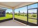 Screened patio with lush green backyard views, perfect for relaxing and entertaining at 5831 Sw 87Th Ave, Ocala, FL 34481