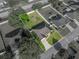 Aerial view of property highlighting a home with fenced backyard with play set, lush landscaping, and a well-manicured lawn at 6272 Cornerstone Dr, Lakeland, FL 33813