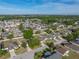 Aerial view of home with fenced backyard, mature trees, and well-maintained landscaping at 6272 Cornerstone Dr, Lakeland, FL 33813