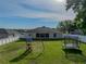 Aerial view of backyard with playset, trampoline, and screened patio at 6272 Cornerstone Dr, Lakeland, FL 33813