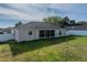 Aerial view of fenced backyard featuring a screened-in patio and grassy yard at 6272 Cornerstone Dr, Lakeland, FL 33813