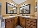 Dual vanity sinks in bathroom offer space for morning routines, set in a stylish space with ample lighting at 6272 Cornerstone Dr, Lakeland, FL 33813
