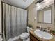 Cozy bathroom with a shower-tub combo and single vanity with granite counter at 6272 Cornerstone Dr, Lakeland, FL 33813