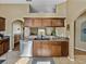 Kitchen with stainless steel dishwasher and sink overlooking the backyard at 6272 Cornerstone Dr, Lakeland, FL 33813