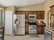 Kitchen featuring stainless steel appliances and lots of upper and lower wooden cabinets at 6272 Cornerstone Dr, Lakeland, FL 33813