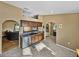 Kitchen with stainless steel dishwasher, lots of counter space, and view into living spaces at 6272 Cornerstone Dr, Lakeland, FL 33813